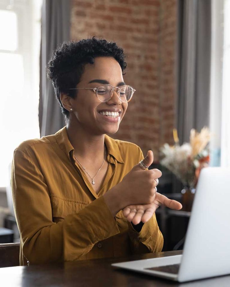 A video interpreter relays instructions for help with a business plan to a customer in ASL.