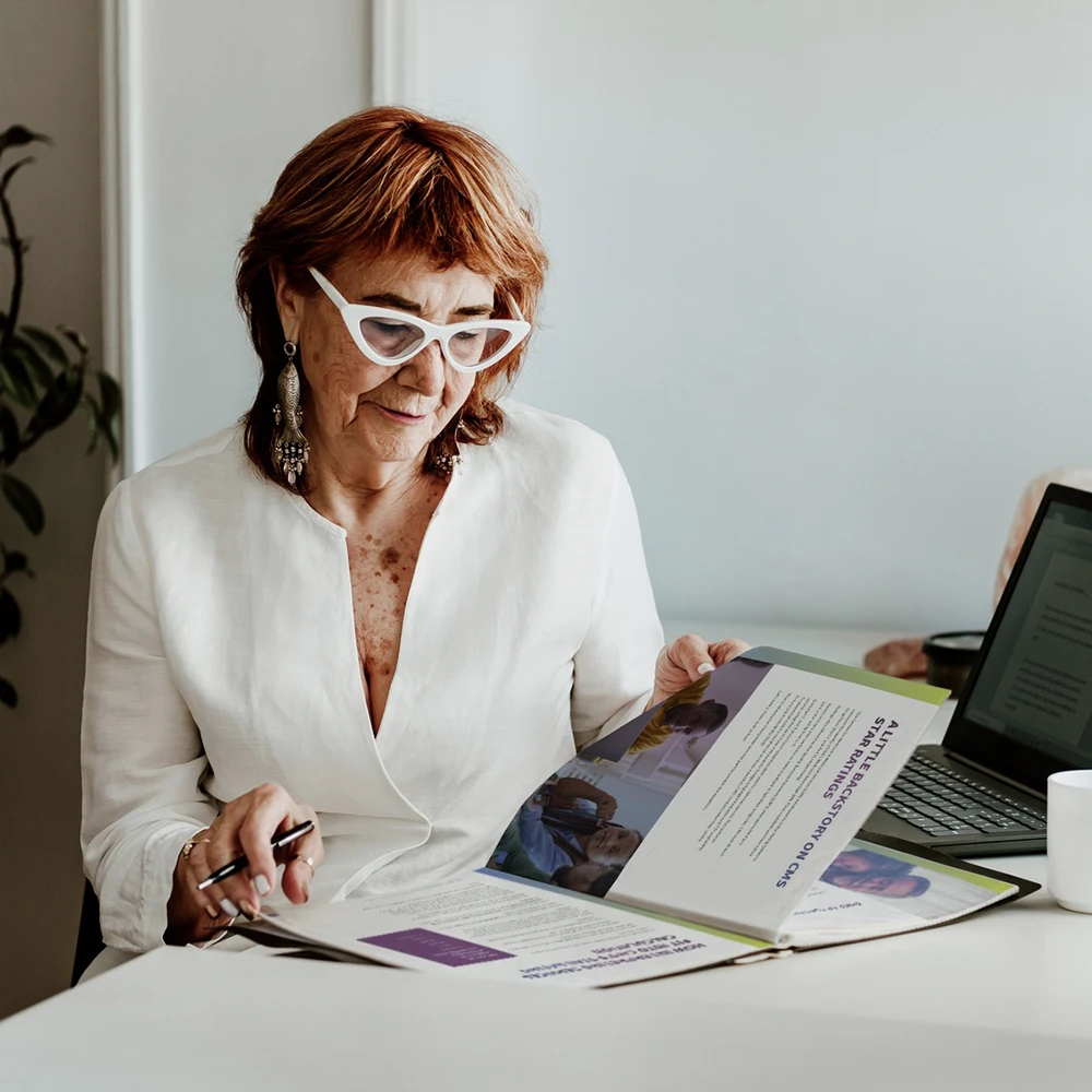 A manager for a health insurance plan reads through the CMS call center monitoring guide from CLI.