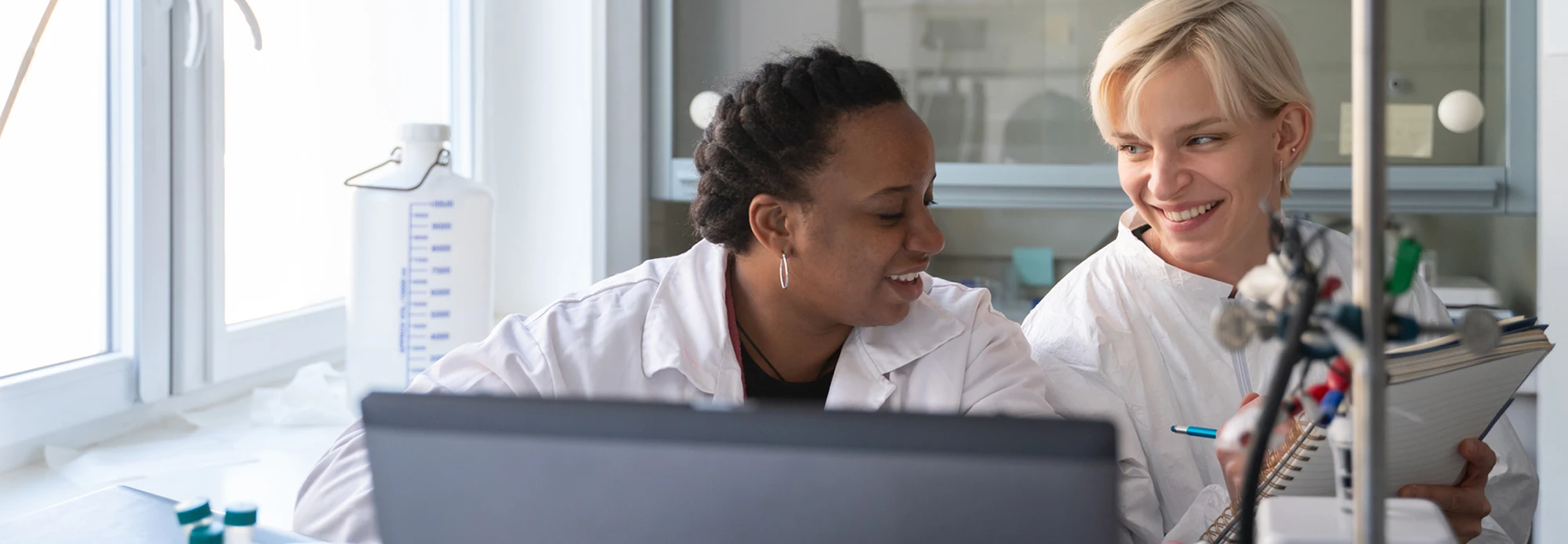 Two dedicated pharmaceutical technicians read through a translated medication study.