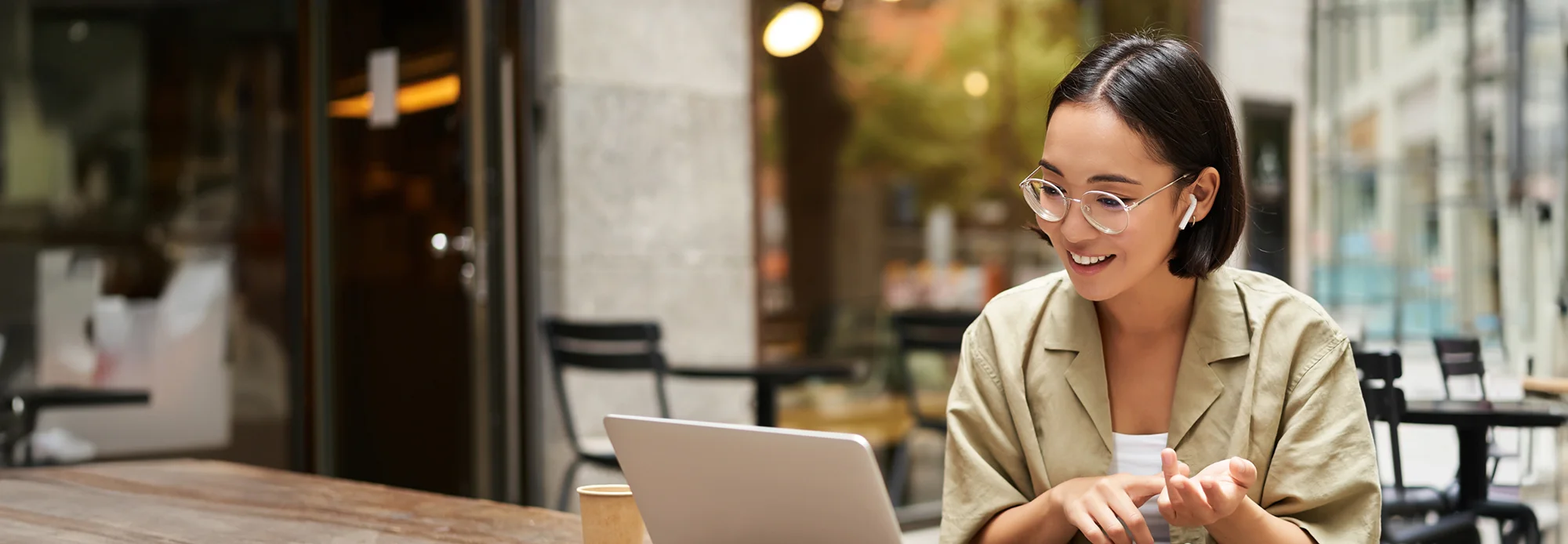 A professional interprets for a client through a laptop.