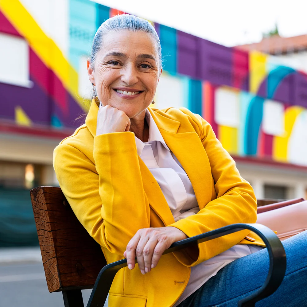 A HIPAA-certified interpreter grins as they wait for the next phone call to assist with.